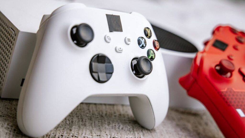 DualSense controller Ghost of Yotei edition with black grips and silver brushwork around touchpad