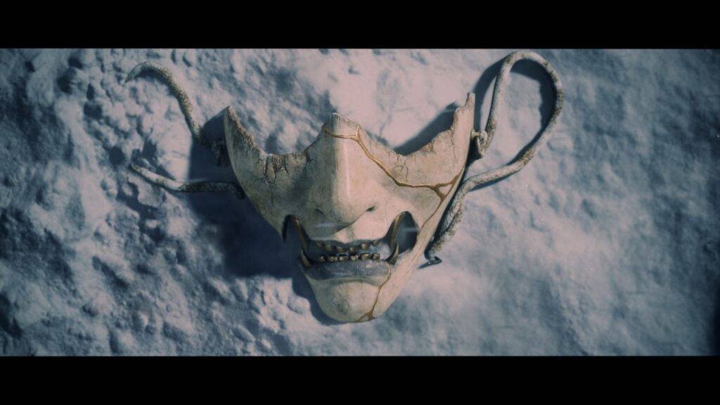 Broken oni mask in snow
